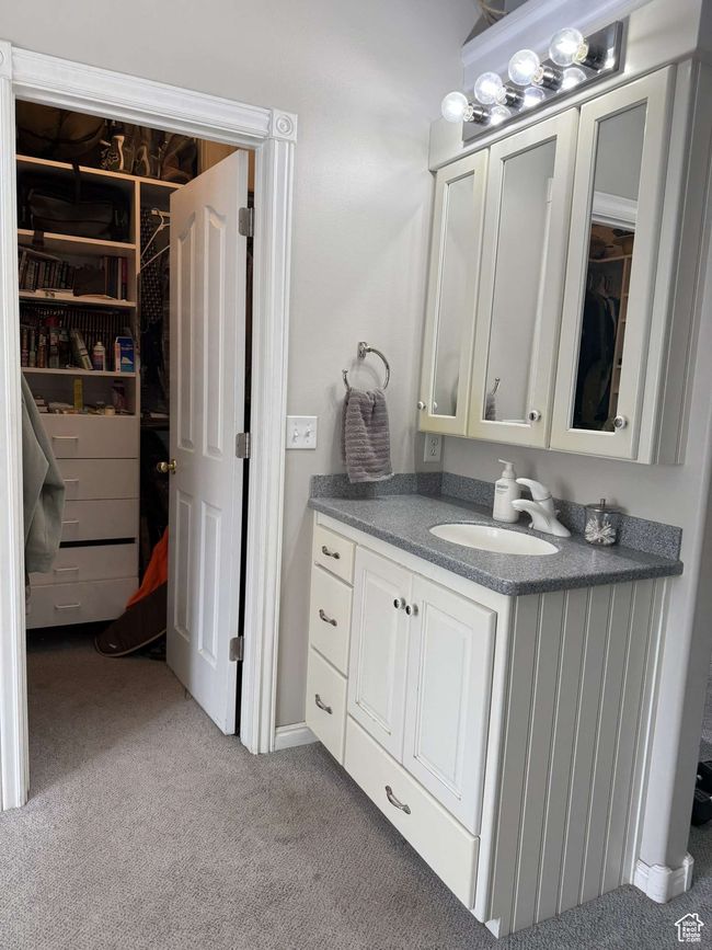 Bathroom featuring carpet and vanity | Image 33