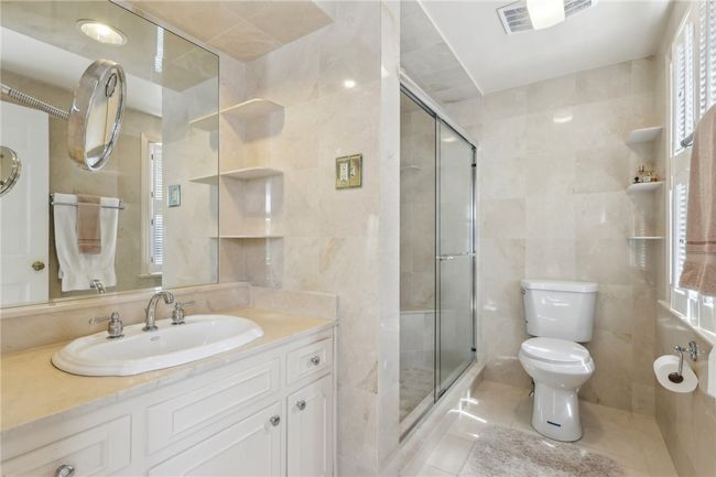 Updated Marble Master Bath. | Image 19