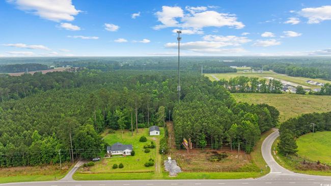 Aerial view of a heavily wooded area | Image 16