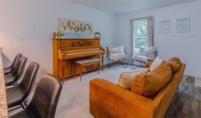 View of the living room looking back to a front window. | Image 7