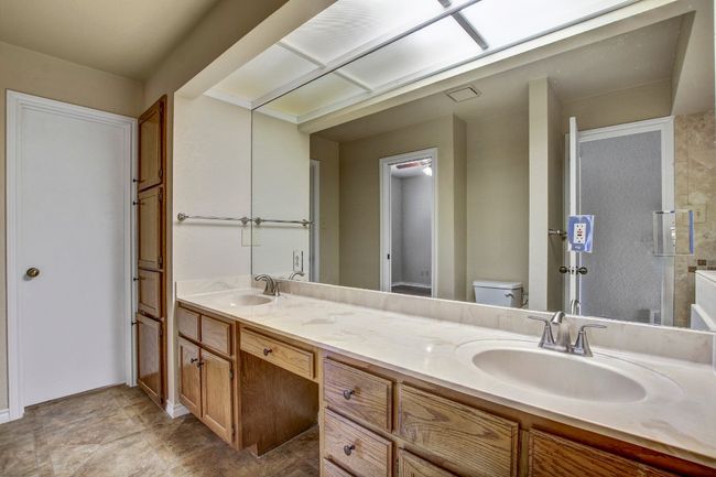 Full bathroom with dual vanities and plenty of storage | Image 23