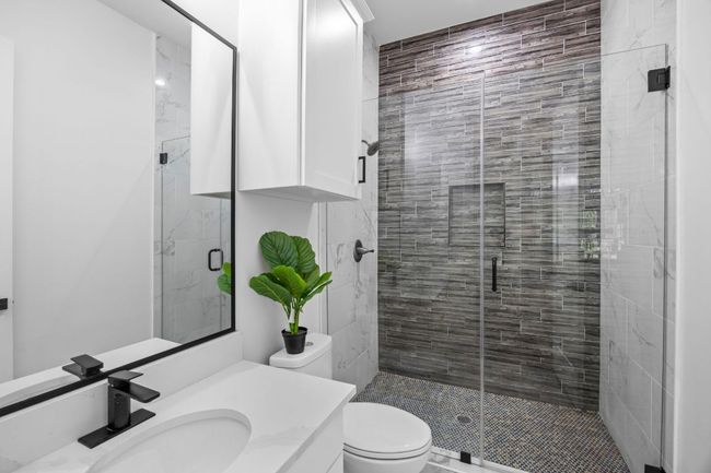 Bathroom with vanity and a walk in shower | Image 22