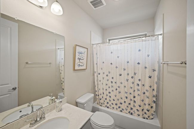 Fourth bathroom features atub/shower combo and vanitywith plenty of counter space. | Image 33