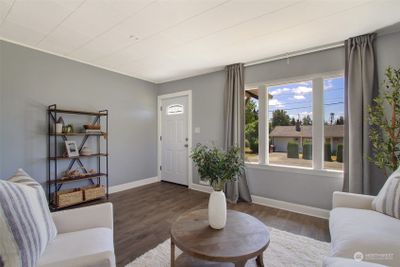 Large front/living room with ample natural light. | Image 3