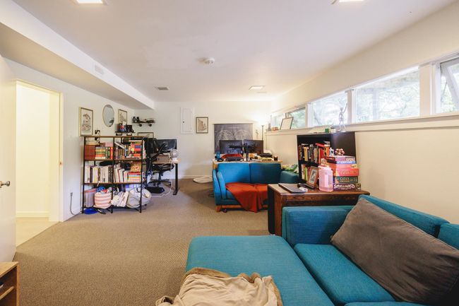 Carpeted living area with baseboards | Image 31