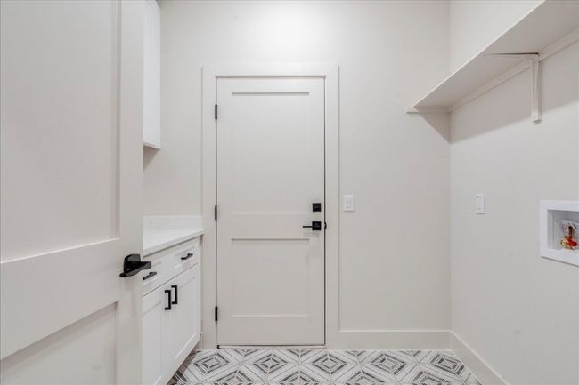 Laundry area with washer hookup and cabinet space | Image 29