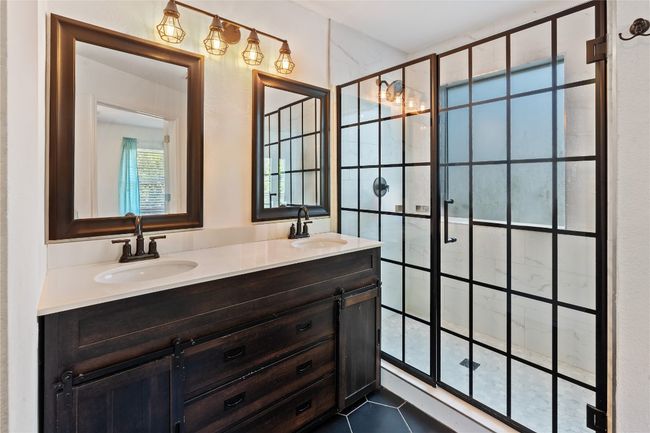 Recently updated bathroom with dual vanities | Image 8