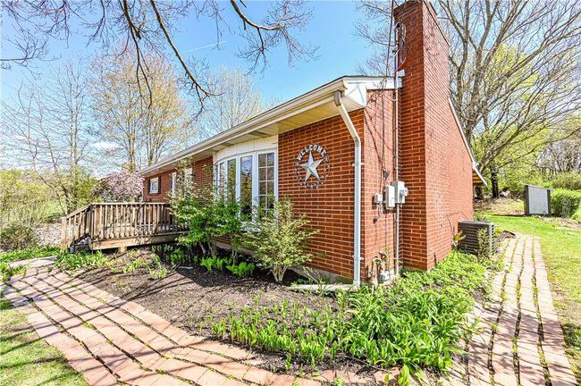The meandering walkway leads you to the back yard area. | Image 4