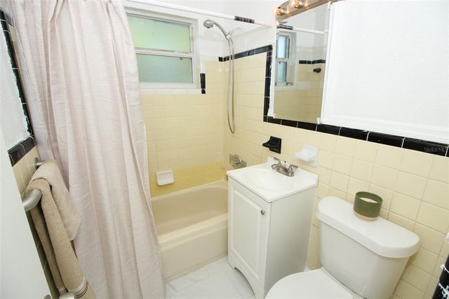 Bathroom has new porcelain flooring. | Image 22