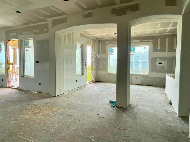 Open archways, generous windows, and a layout designed for memory-making — the dining room offers views of both the beach and backyard, creating a coastal canvas for gatherings large and small. | Image 31
