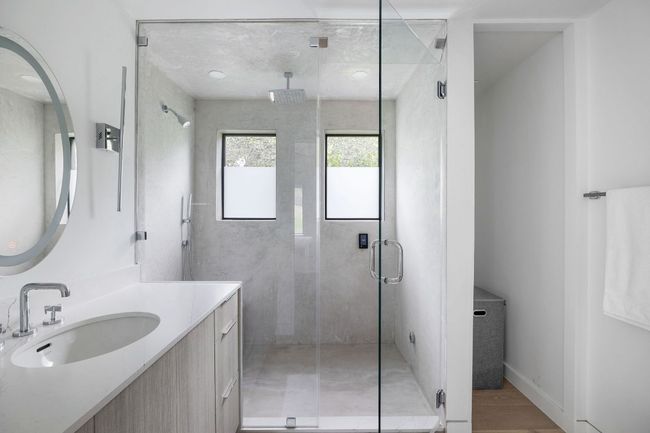 Bathroom featuring vanity and a stall shower | Image 38