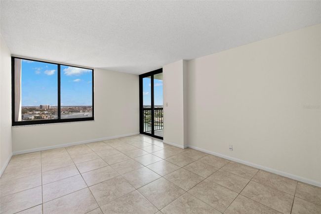 Primary bedroom with balcony access | Image 20