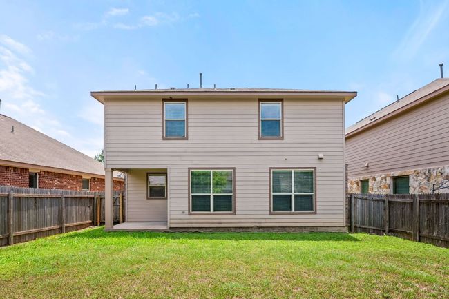 Back of house with a fenced backyard and a patio | Image 30