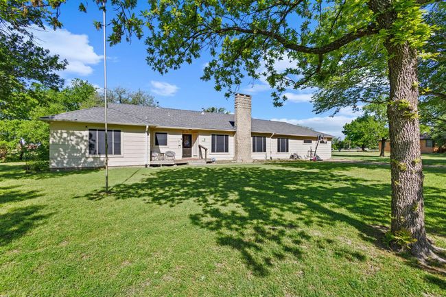 Rear view of house featuring a yard and a chimney | Image 40