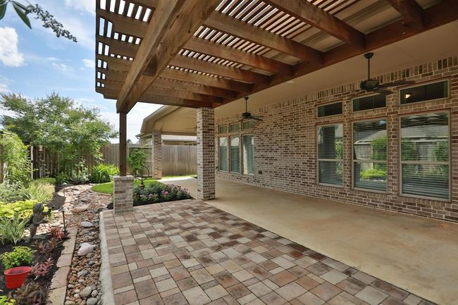 View of Backyard from Gazebo. Covered Patio has Two Ceiling Fans. | Image 29