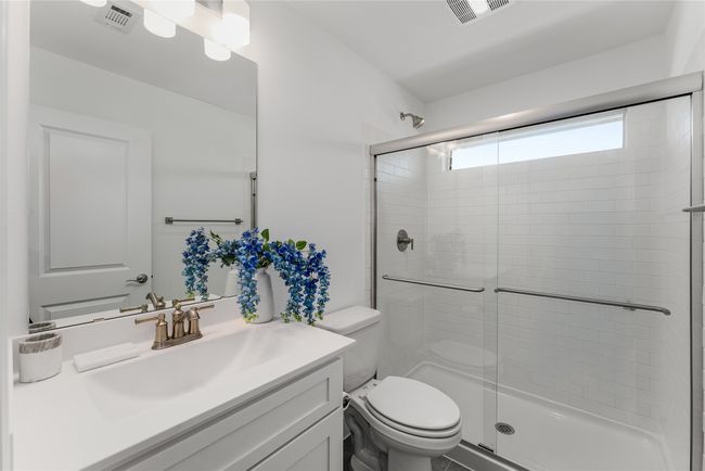 Bathroom with vanity and a stall shower | Image 26