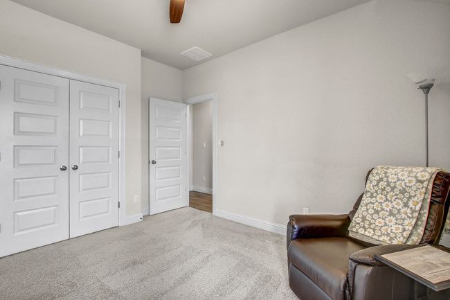 Sitting room featuring carpet floors and a ceiling fan | Image 35