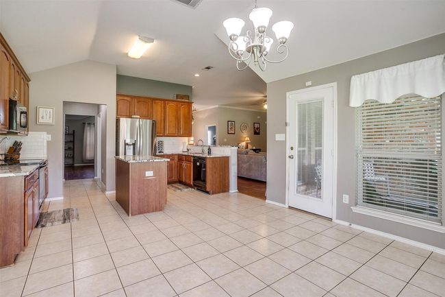 Dining area with tile. | Image 17