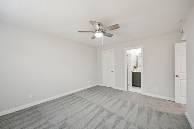 Lovely paint colors and new carpet and ceiling fan... and a large walk-in closet, too! | Image 27
