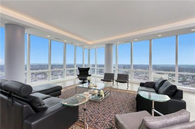 Living room with floor to ceiling windows | Image 1