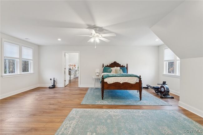 Bedroom featuring recessed lighting, baseboards, and wood finished floors | Image 36