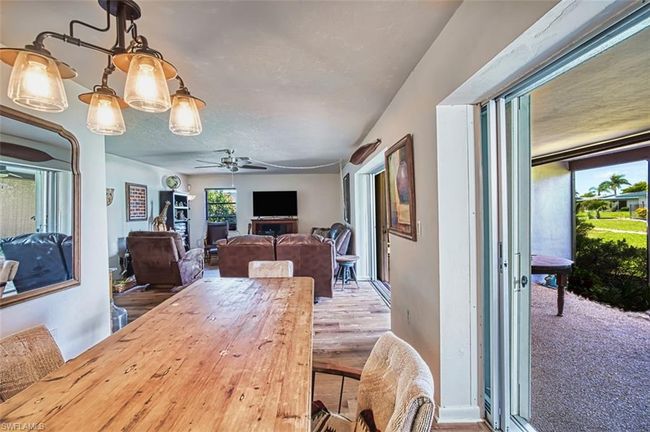 Dining room featuring ceiling fan | Image 14