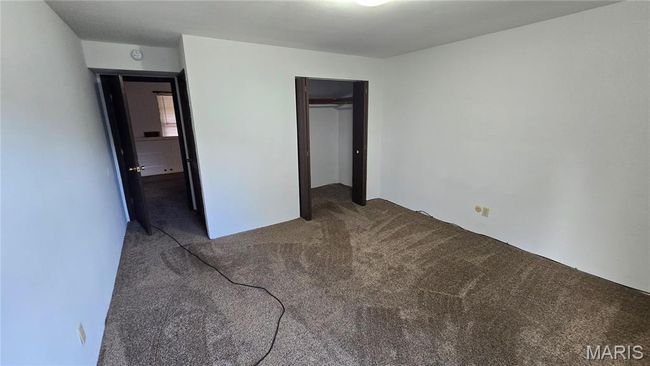 Unfurnished bedroom featuring carpet and a closet | Image 6