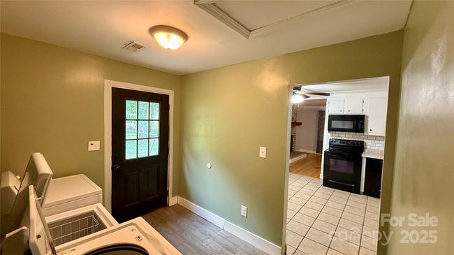 Laundry room and exit to yard | Image 13
