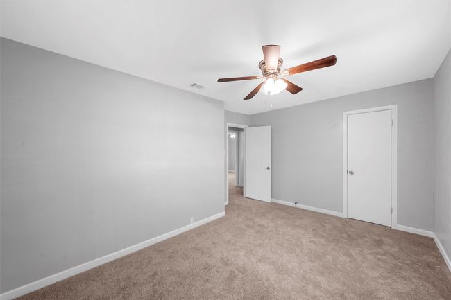 Unfurnished bedroom featuring carpet flooring and a ceiling fan | Image 15