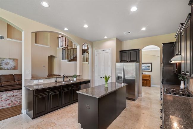 Another view of this spacious area. It includes an under the sink Reverse Osmosis Filtration System. | Image 12