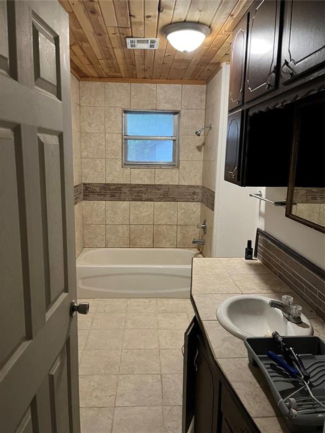 Full bath with vanity, shower / tub combination, and wooden ceiling | Image 16