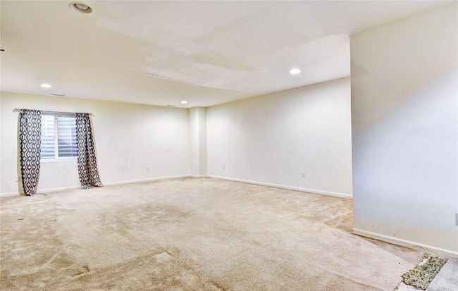Carpeted spare room with recessed lighting and baseboards | Image 27