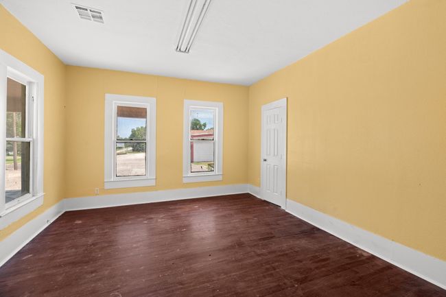 Unfurnished room with dark wood-type flooring and baseboards | Image 8