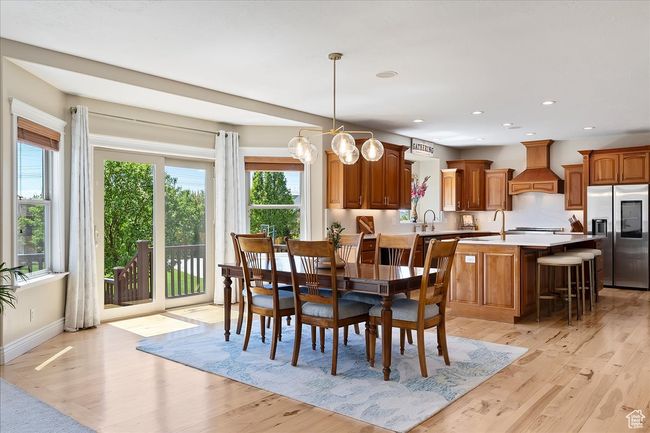 Dining space with recessed lighting, baseboards, and light wood-style floors | Image 12