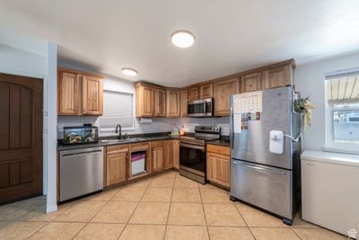 5065 S Stardust Dr, House other with 4 bedrooms, 1 bathrooms and 5 parking in Taylorsville UT | Image 2