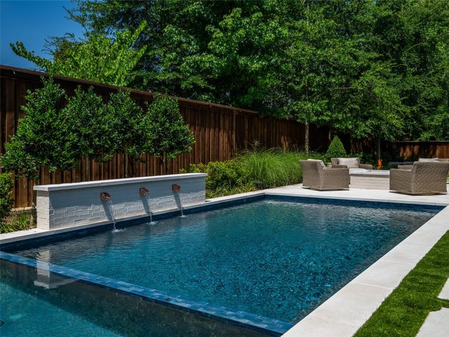 View of pool with an outdoor living space and a fenced backyard | Image 39