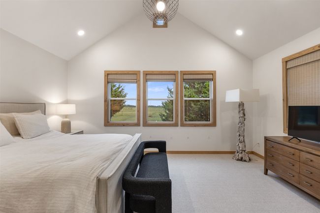 Bedroom featuring light carpet, recessed lighting, and high vaulted ceiling | Image 19