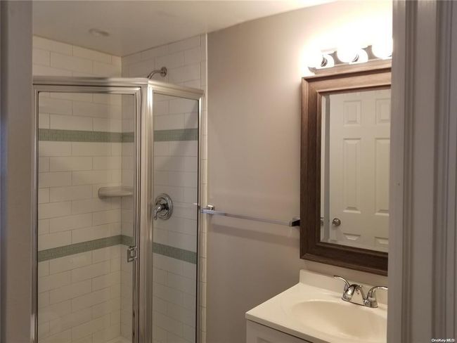 Full bath with a shower stall and vanity | Image 11
