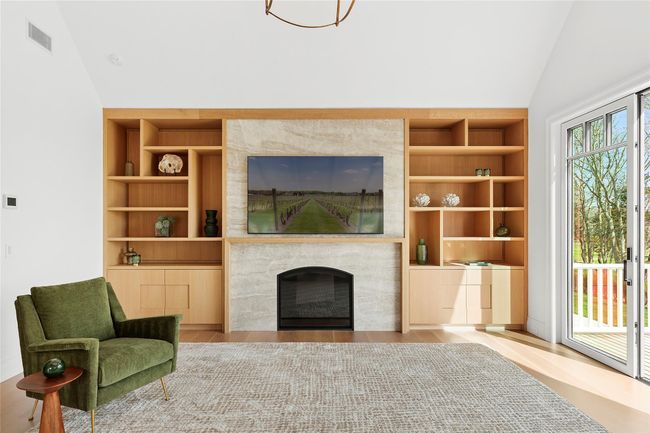 Primary Bedroom sitting area with fireplace & custom built-ins | Image 18
