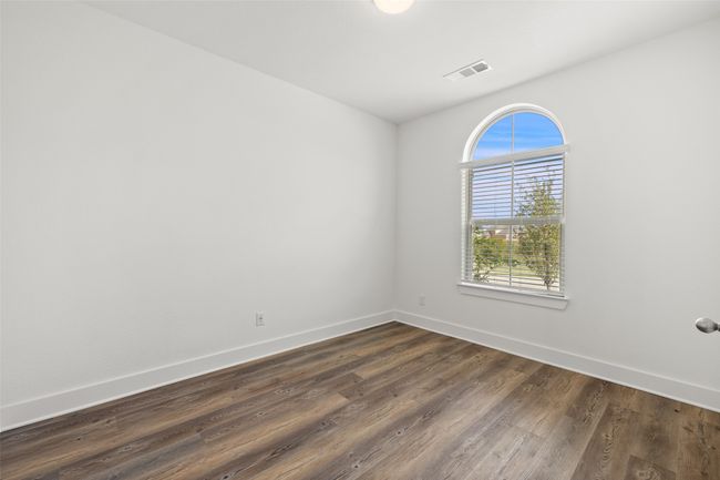 Unfurnished room featuring dark wood finished floors, baseboards, and visible vents | Image 16