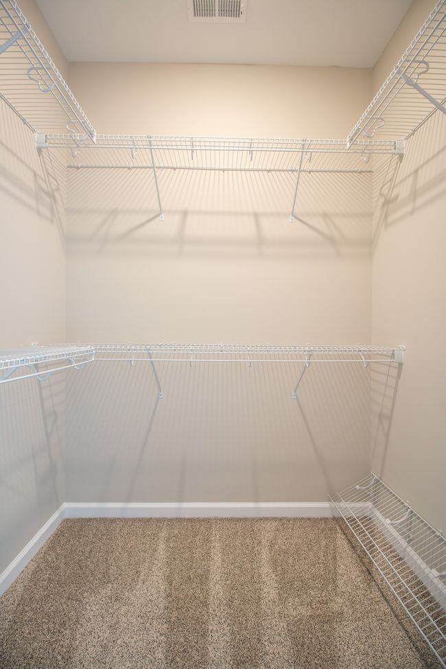 One of the Walk-in Closets! Tons of Shelving!! (Primary Bedroom) | Image 14