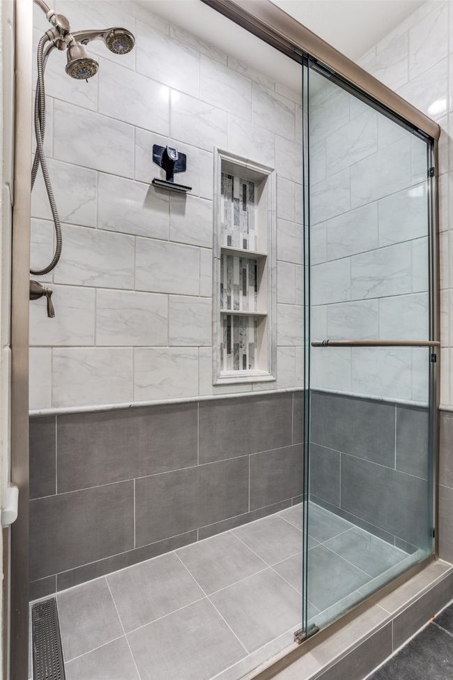 Full bathroom with a shower stall and tile patterned floors | Image 13