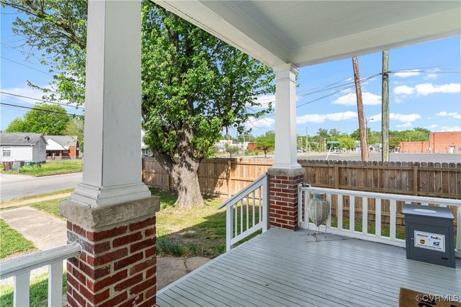 Wooden deck with a porch and fence | Image 5