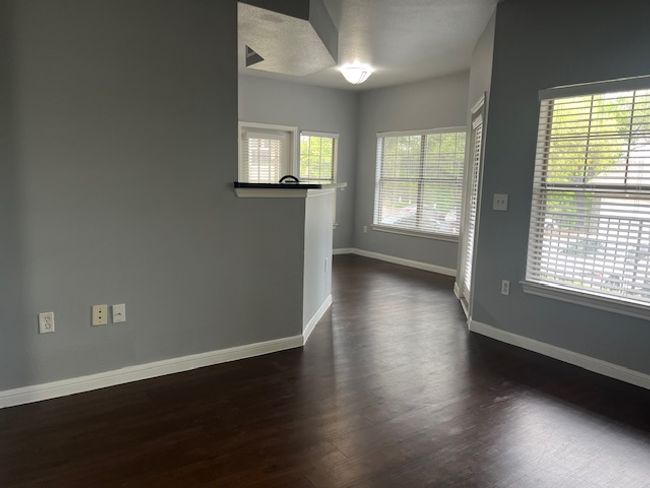 Empty room featuring dark wood finished floors and baseboards | Image 6