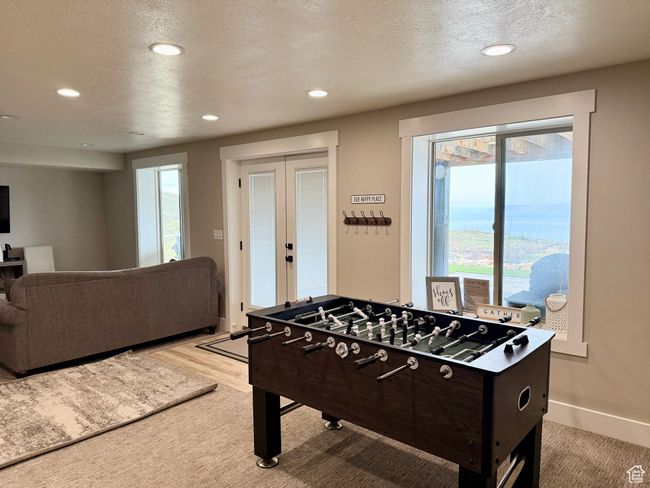 Rec room featuring french doors, recessed lighting, and a textured ceiling | Image 38