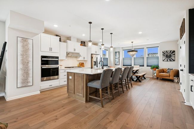 Beautiful hardwood floors on the main level are easy to care for and bring a warm, comfortable feel while maintaining a modern look. | Image 18