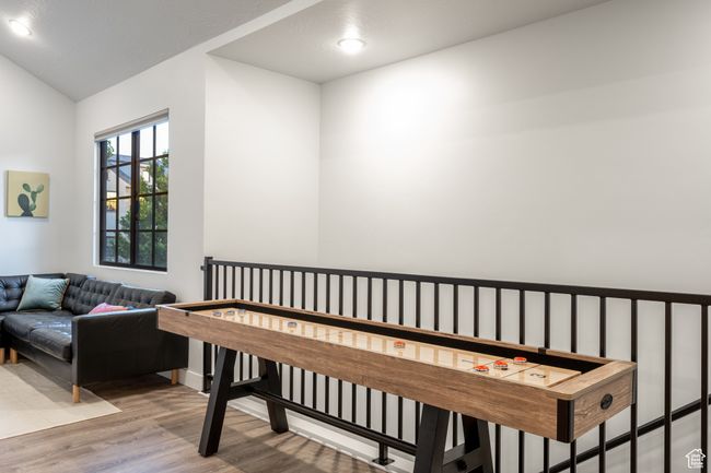 Recreation room featuring vaulted ceiling and light hardwood / wood-style flooring | Image 21