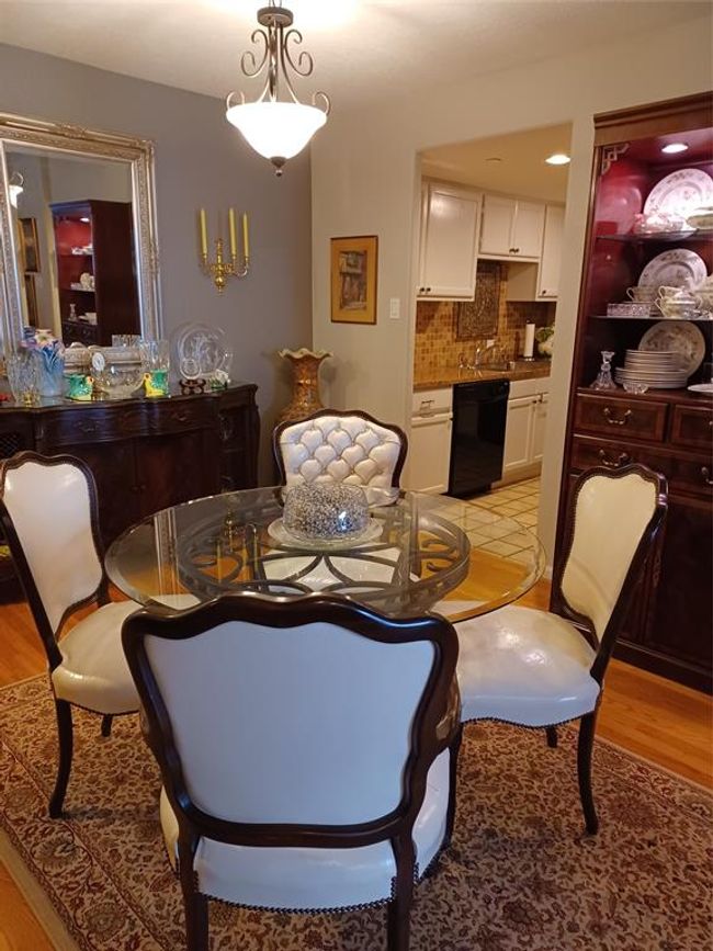 Looking toward the kitchen from the dining room. | Image 10