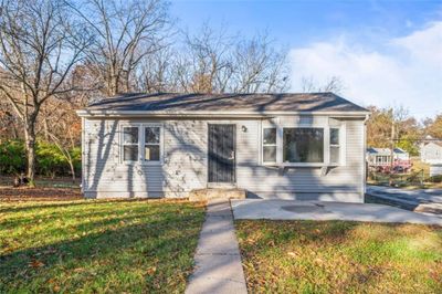 Bungalow featuring a front lawn | Image 1