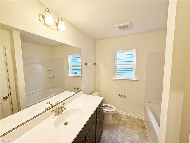 Loft overlooking the family room and a full hall bath complete the second floor. | Image 17